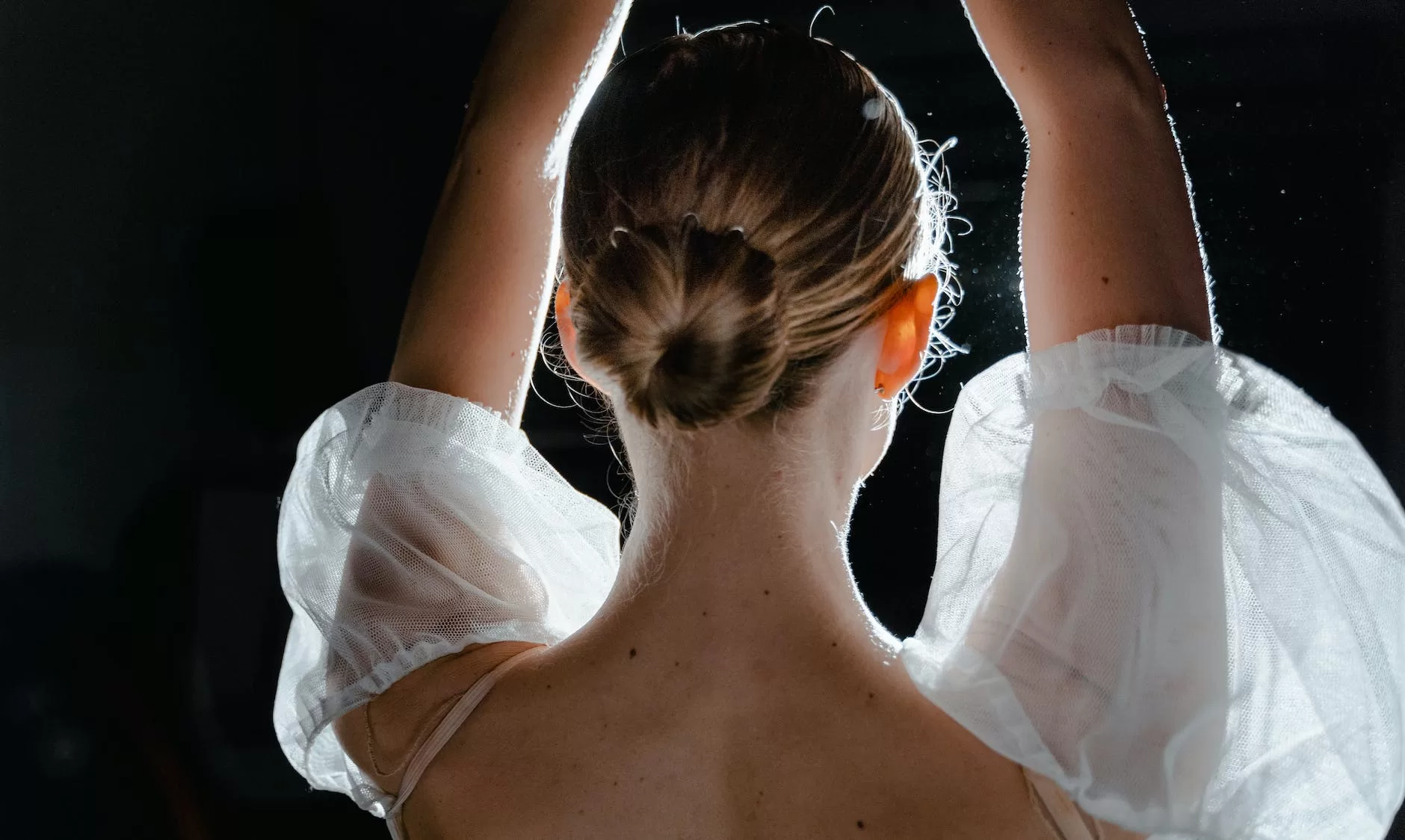 back view of a woman in a hair bun