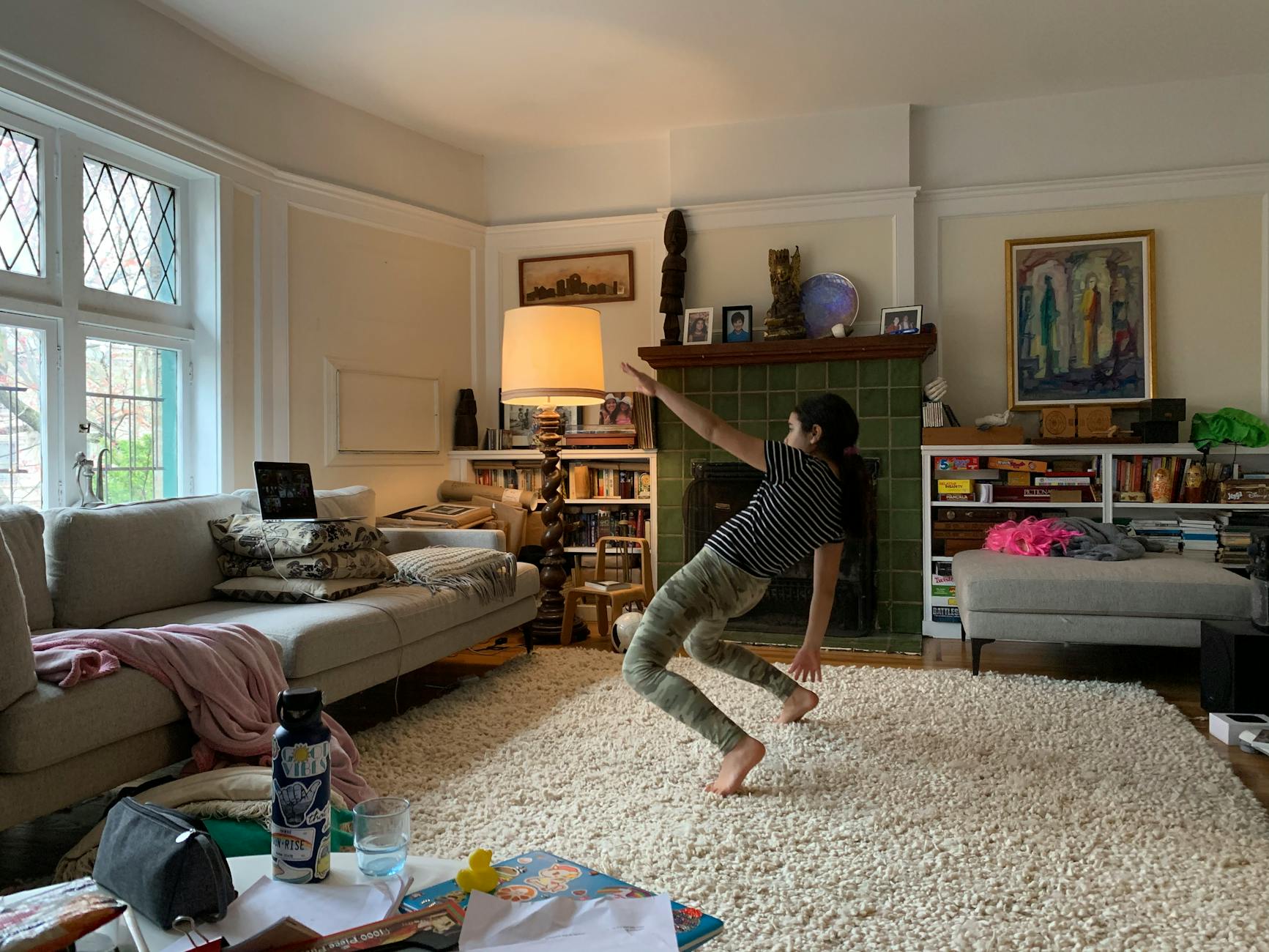 a woman dancing in the living room